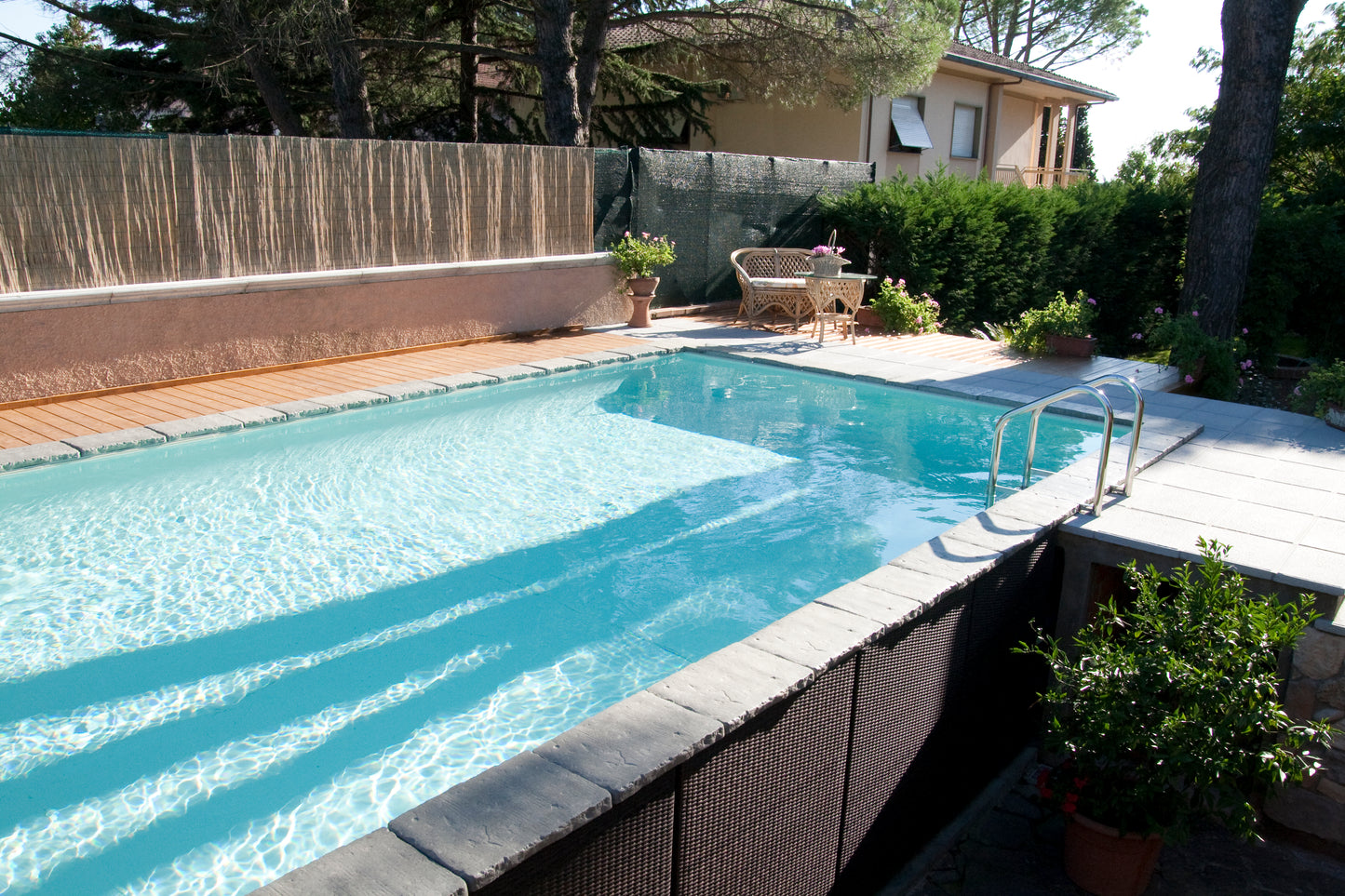 Aufstellpool kaufen 3x6 mit Holz und Stein